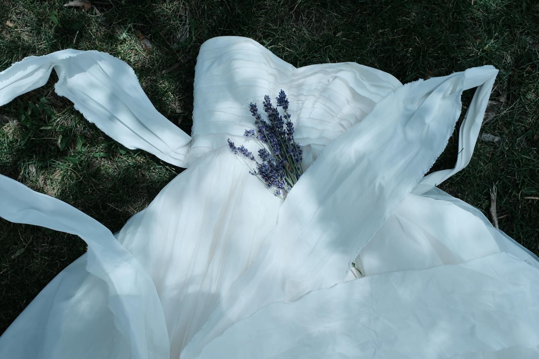 elegant wedding dress with lavender bouquet