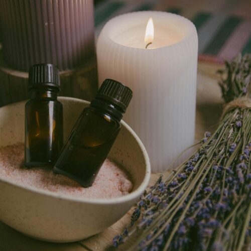 close up view of cosmetic product and candle